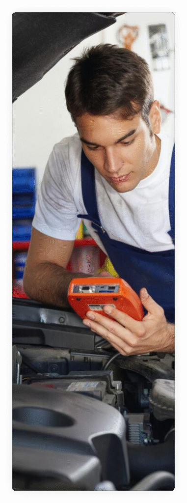young-man-working-as-mechanic-repairing-car-engine-682x1024.jpg